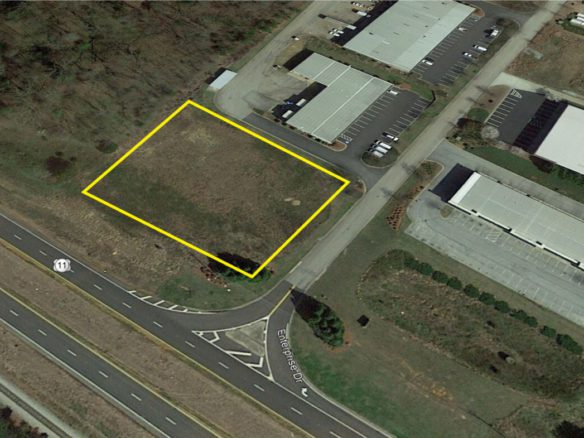 A yellow line is drawn across the top of an aerial photo.