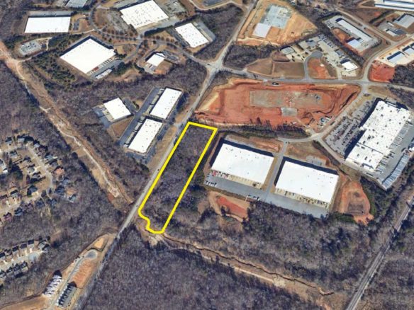 A yellow line is drawn across the top of an aerial photo.