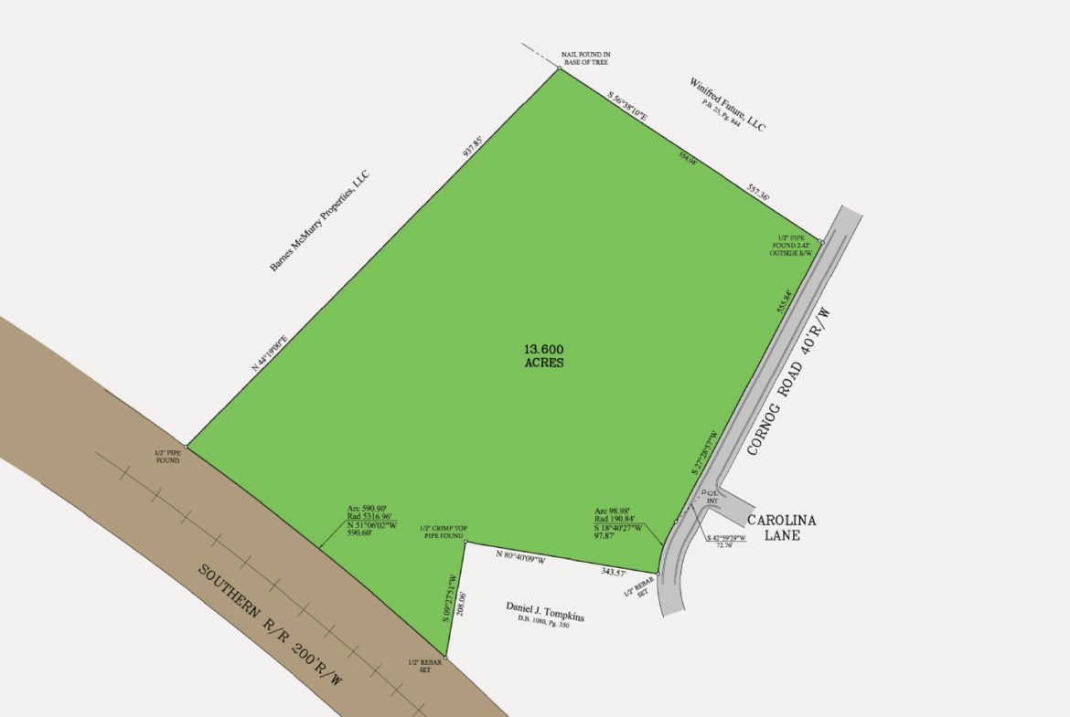 A map of the area with green fields and brown street.