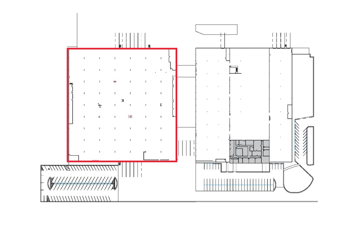 A floor plan of an industrial building with a red line drawn across the top.