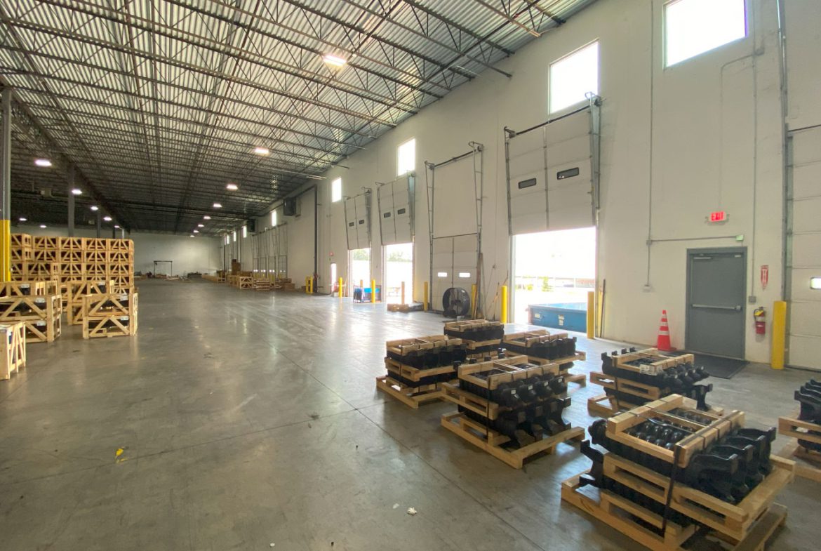 A warehouse filled with lots of pallets and boxes.