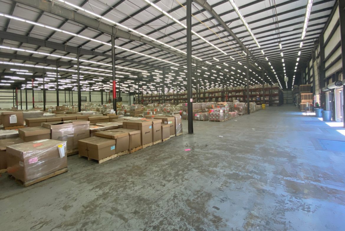 A warehouse filled with lots of boxes and other items.