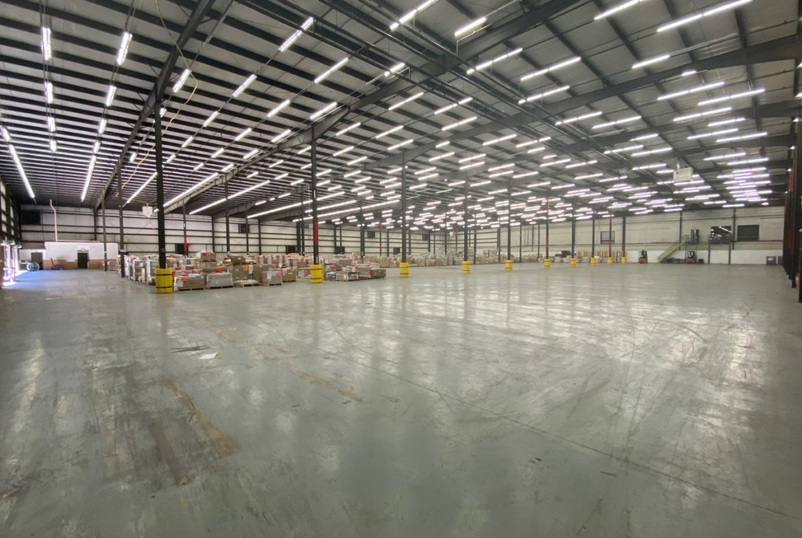 A large warehouse with many boxes in it.